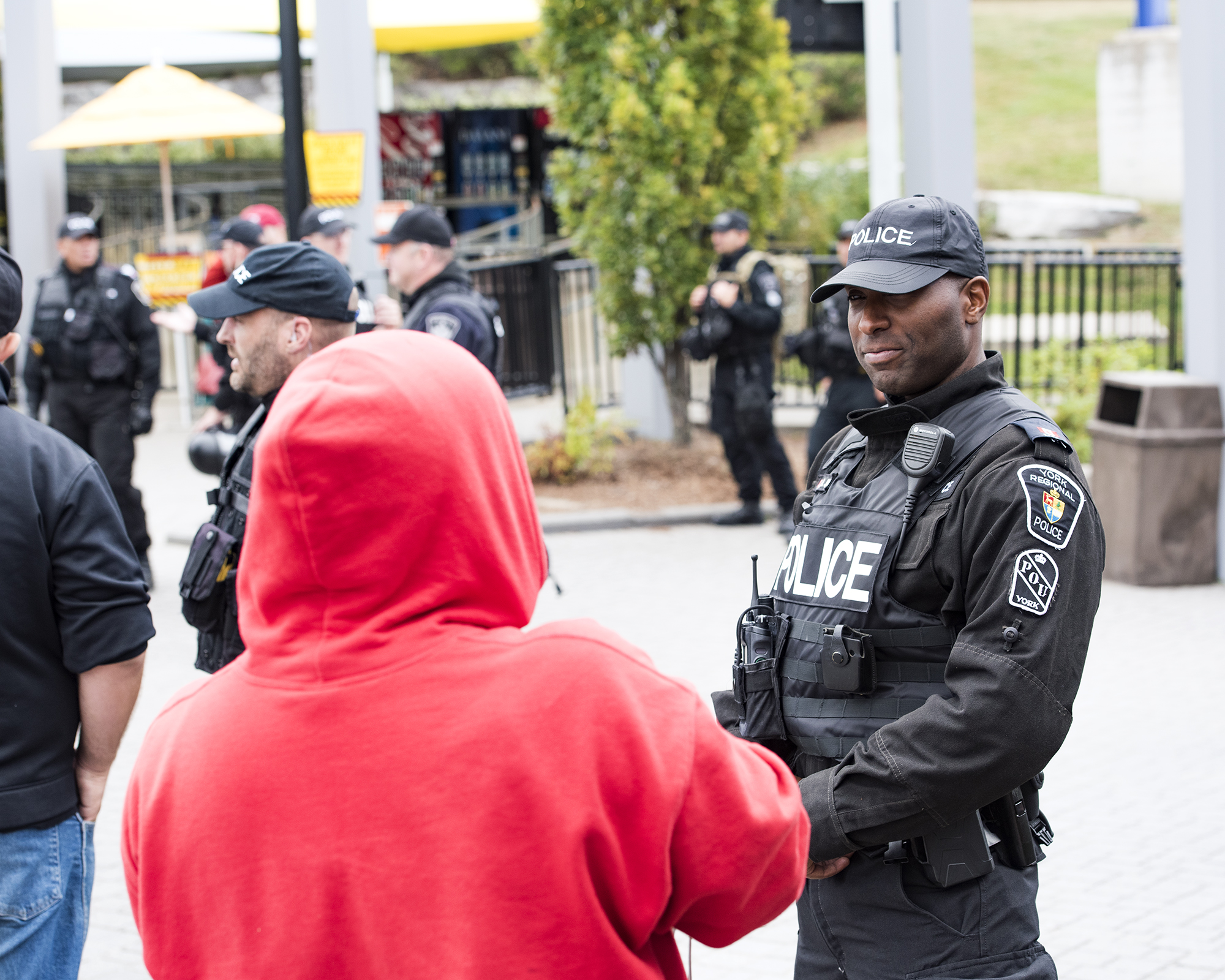An officer speaks to a person at a protest