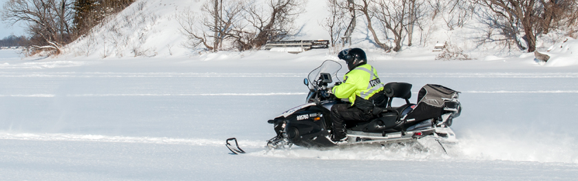 An officer on a snowmobile