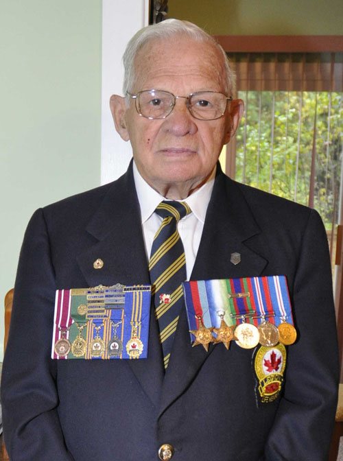 A man wears medals on his chest