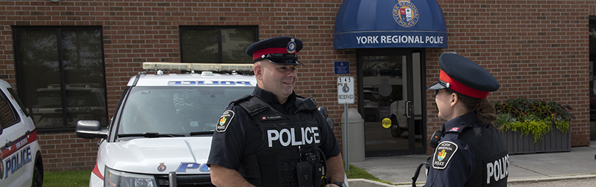 Two police officers in front of Stouffville substation