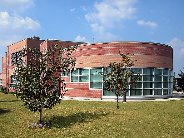 A brown building with a rotunda