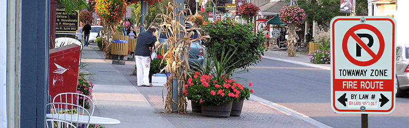 A city street with a No Parking sign