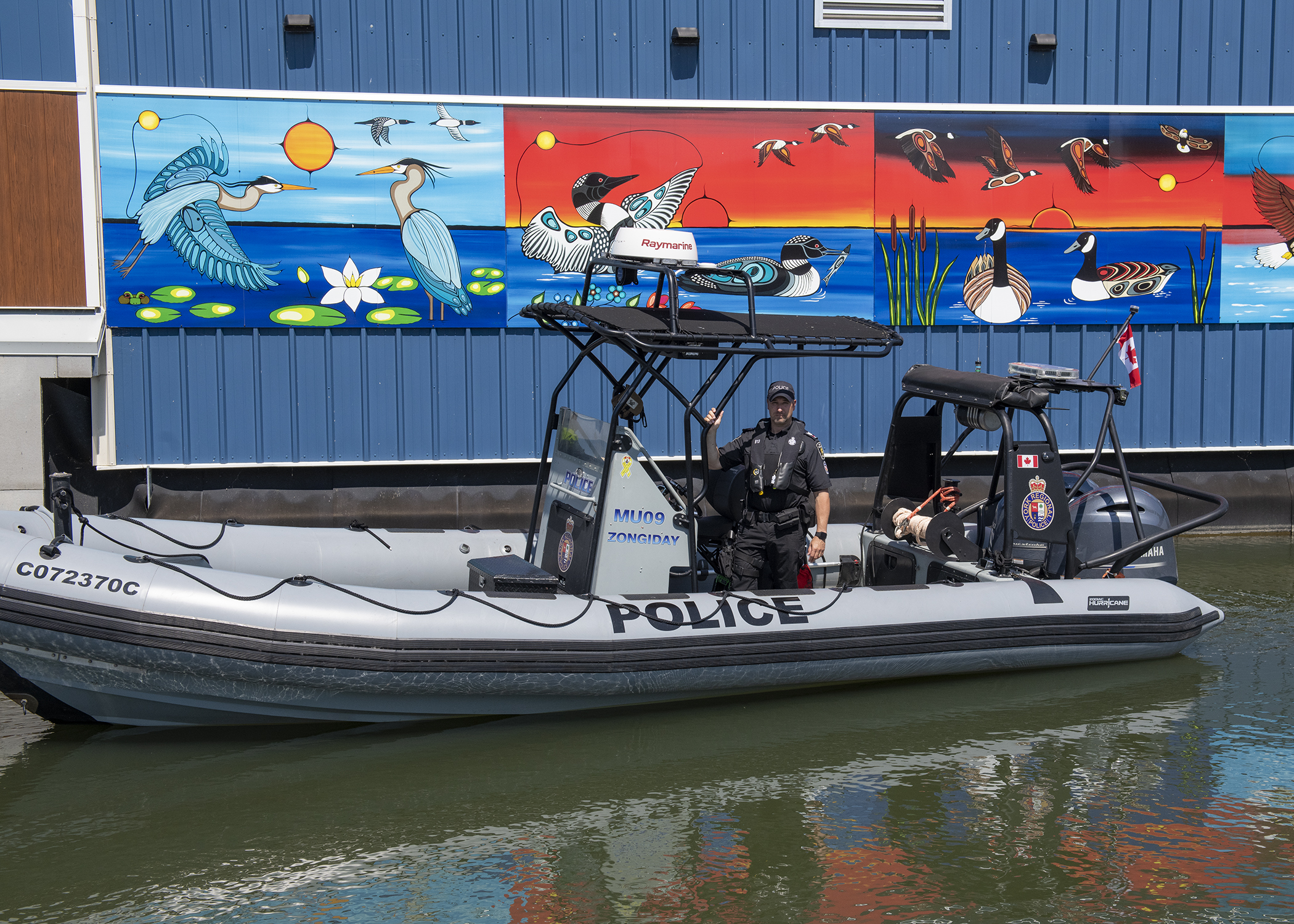 An officer in uniform on a boat