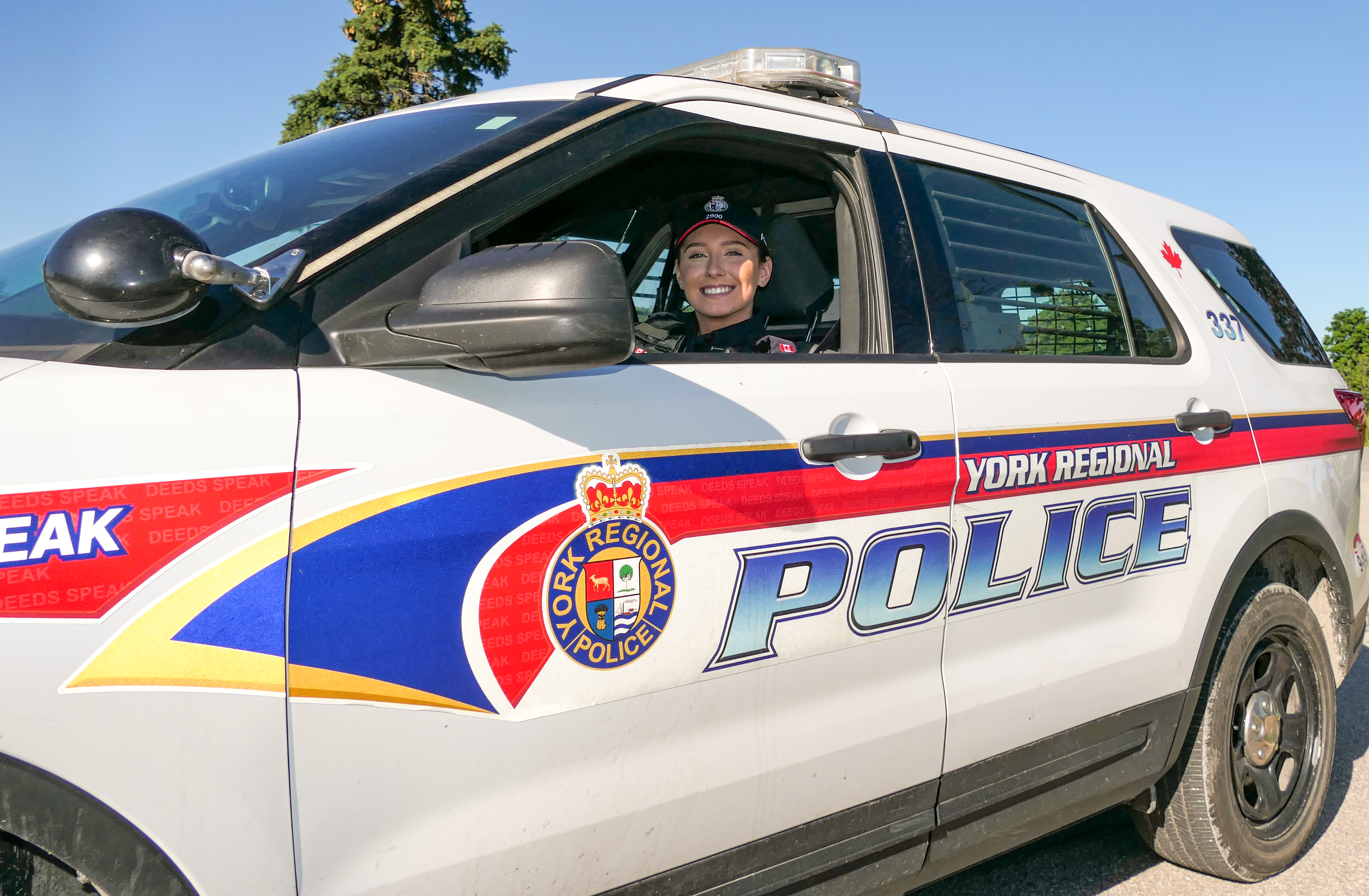 A female officer in a cruiser