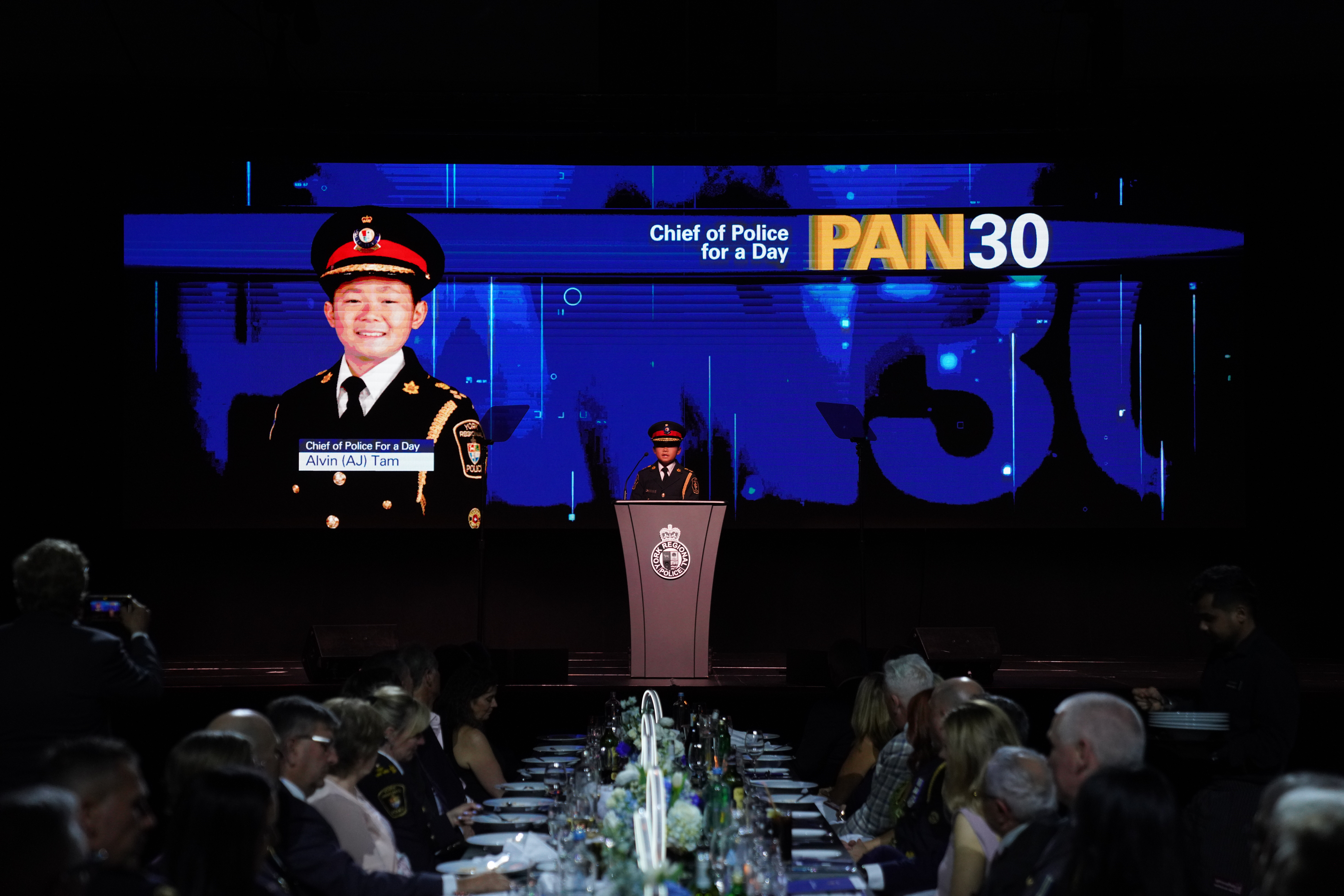 AJ Tam addresses the crowd at PAN from the stage