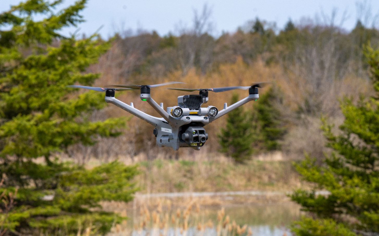 A YRP drone flies over a pond.