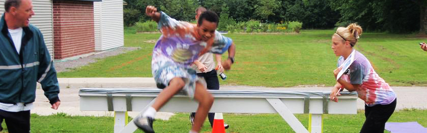 Kids jumping over railing