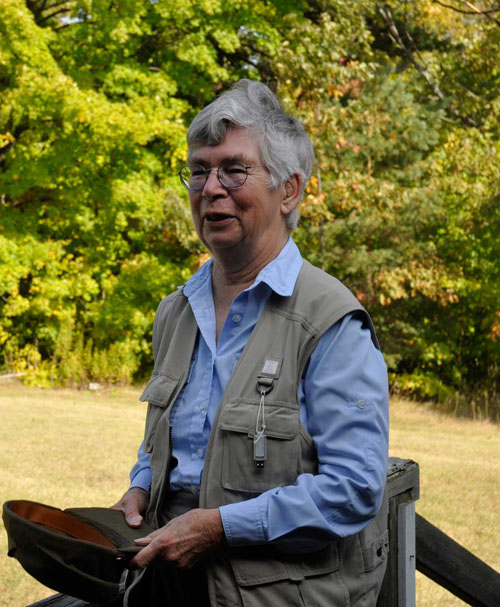 A woman sits outdoors