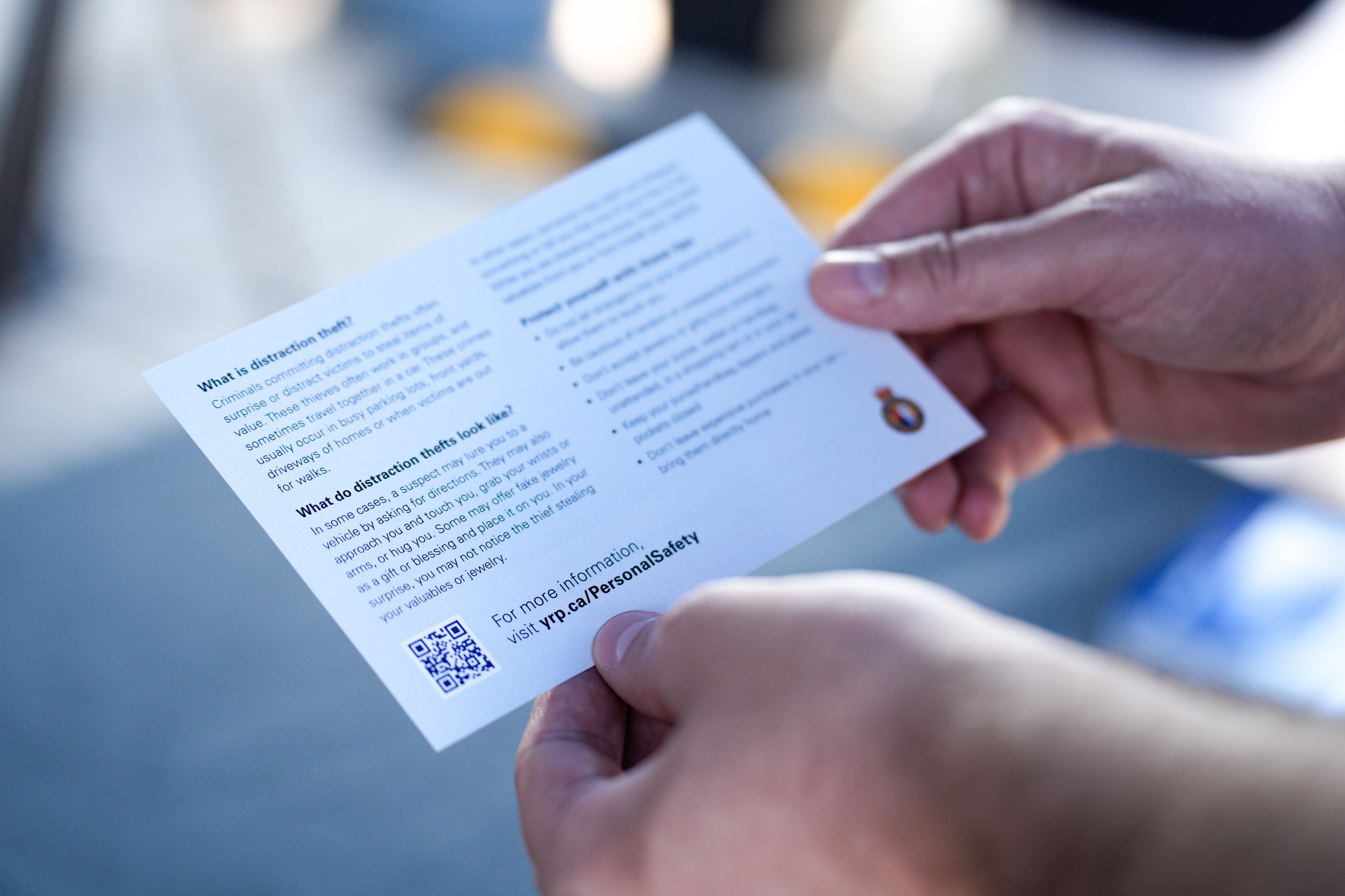 Distraction theft prevention tips on a postcard