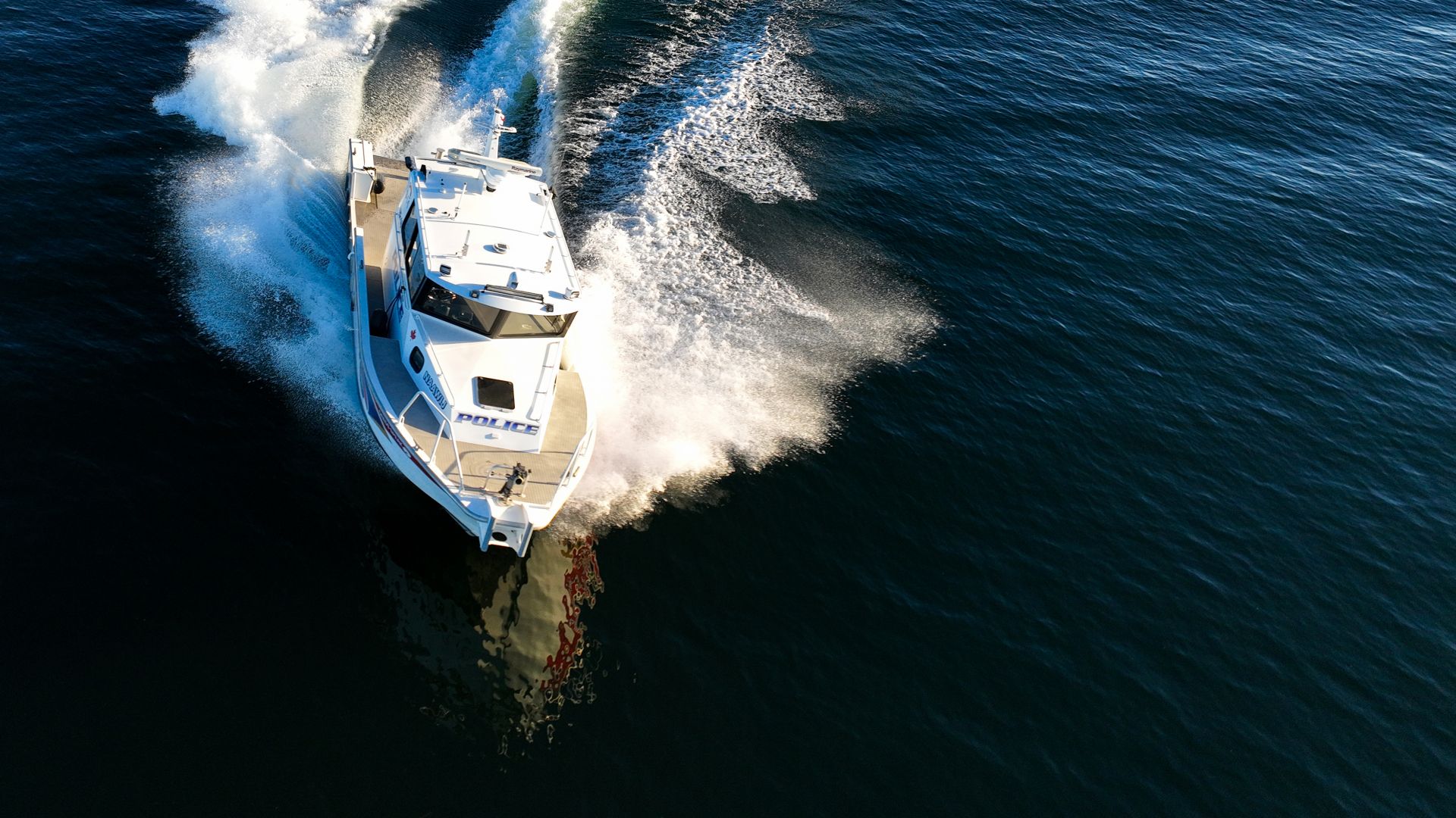 A boat turns on the water