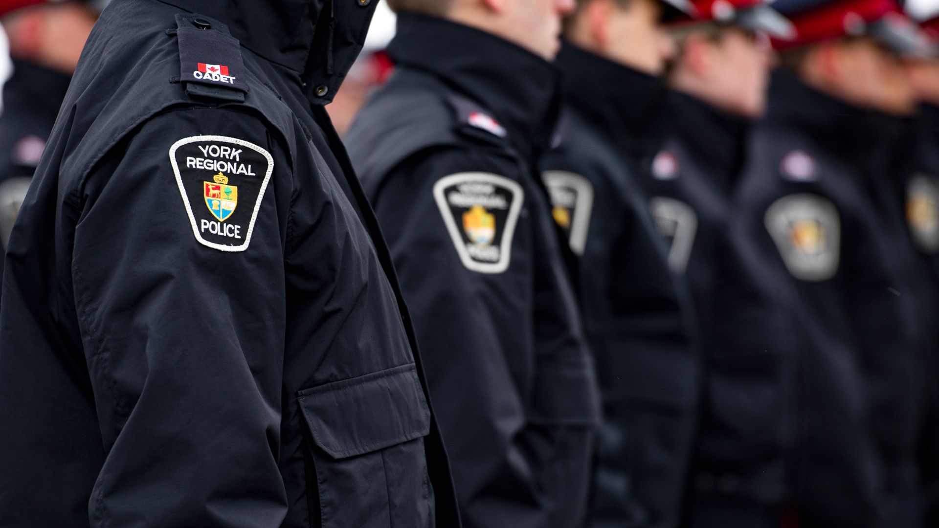 A row of police officers wearing York Regional Police jackets
