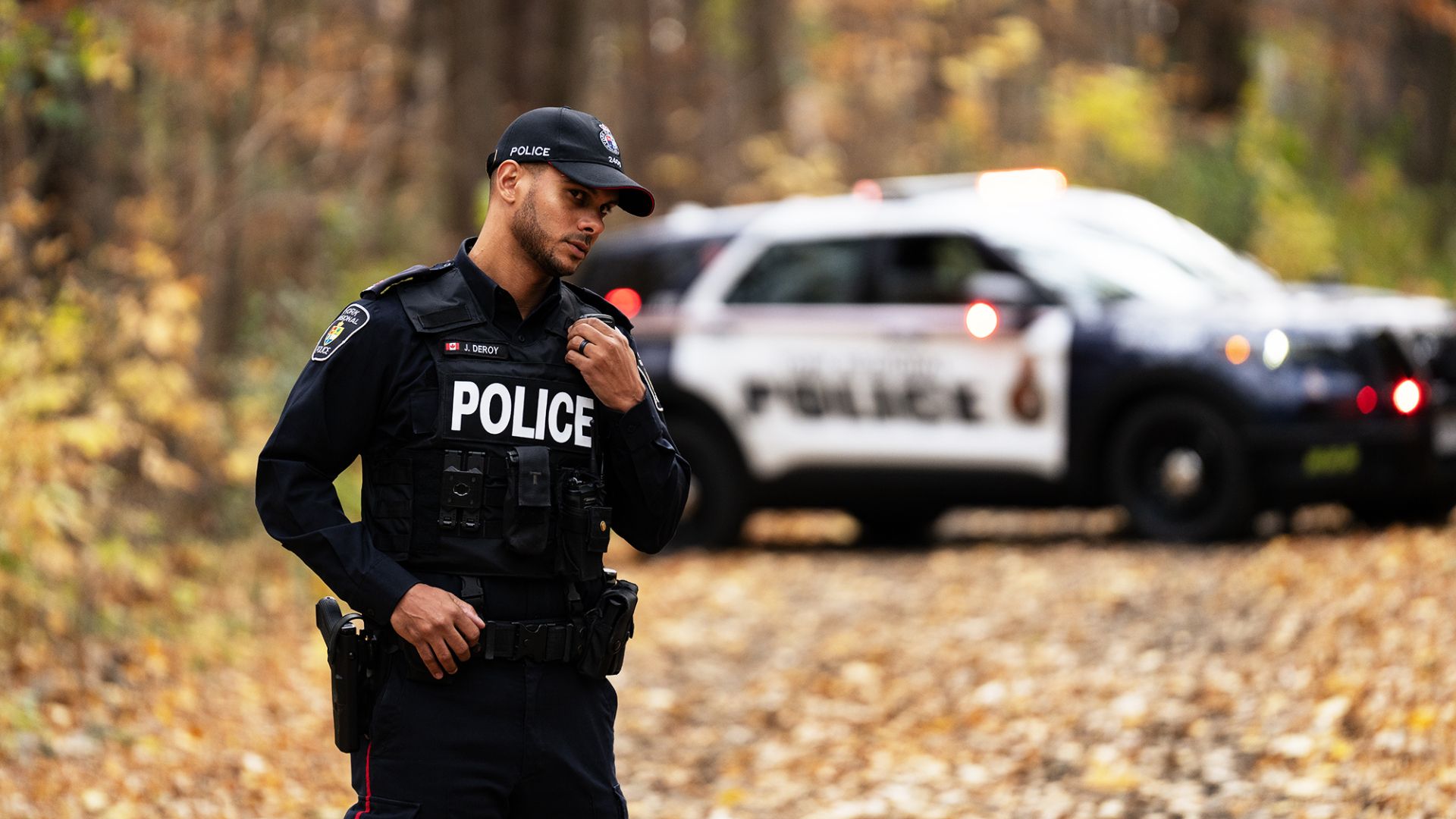 A man in a police uniform on a radio 