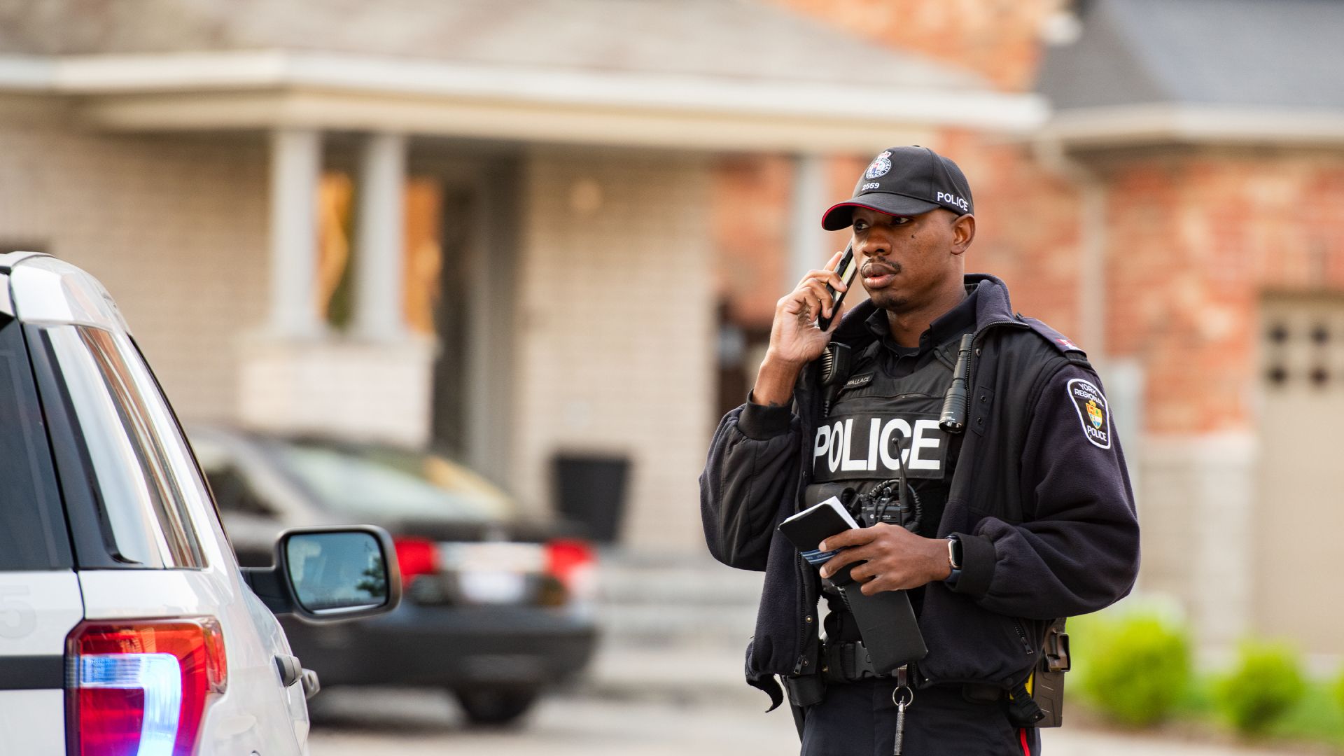 An officer on a phone
