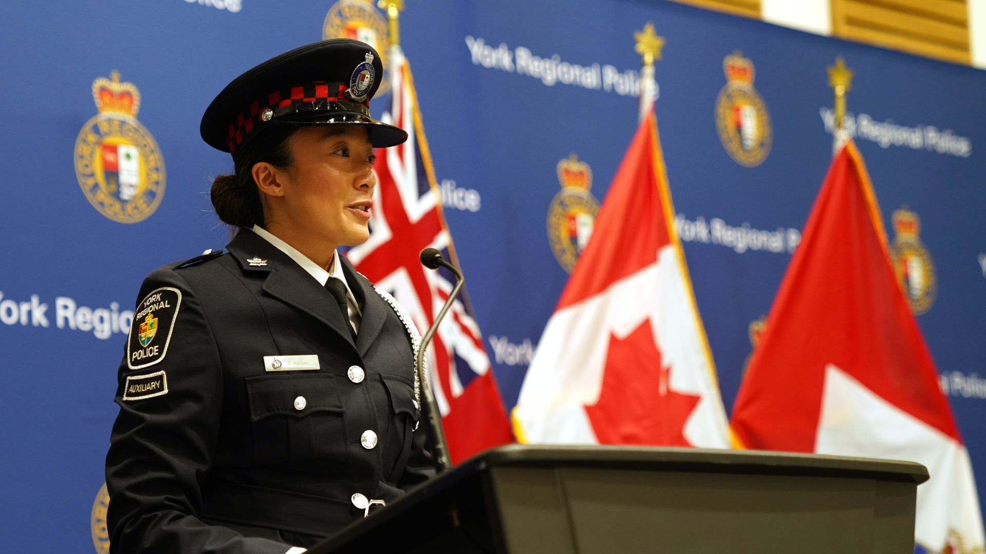A woman in a uniform at a podium