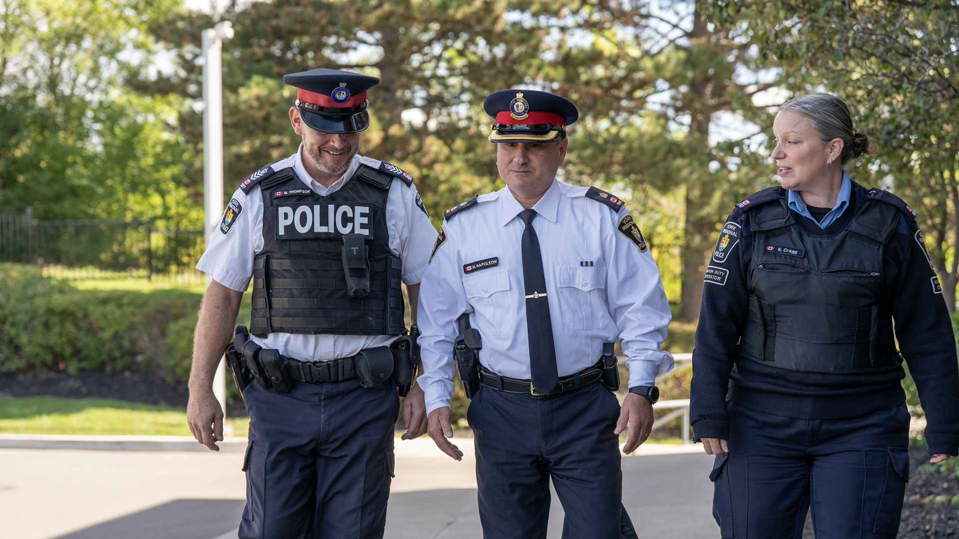 Officers in uniform walk and talk