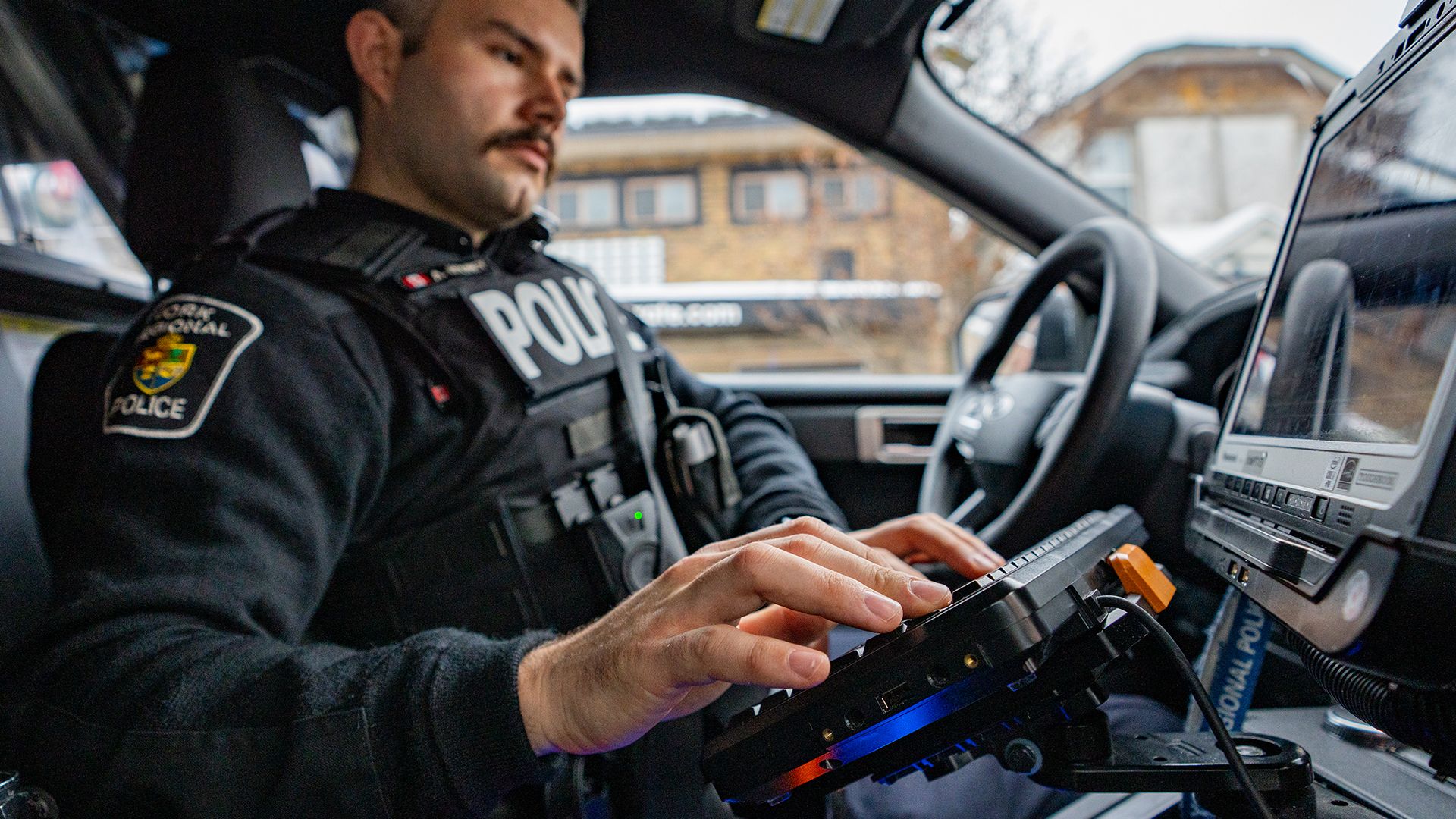 officer in cruiser
