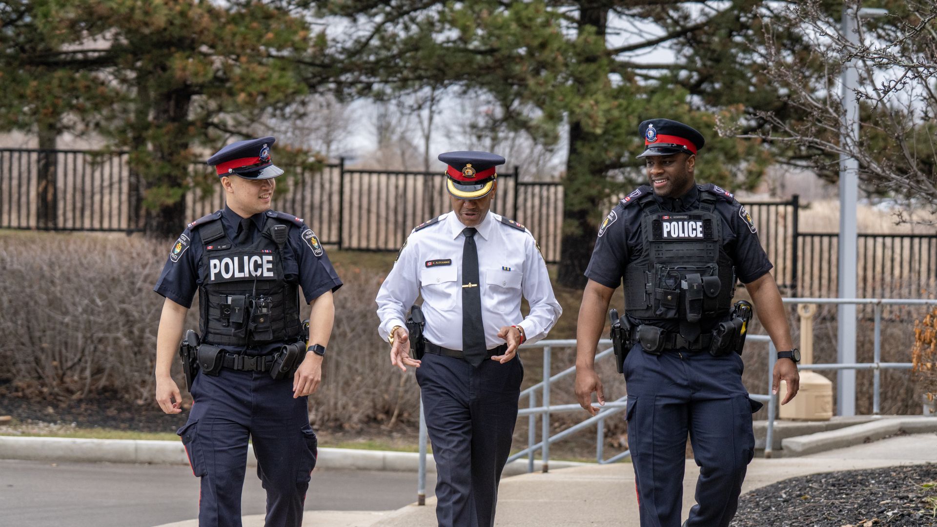 Officers talking with a Super while walking
