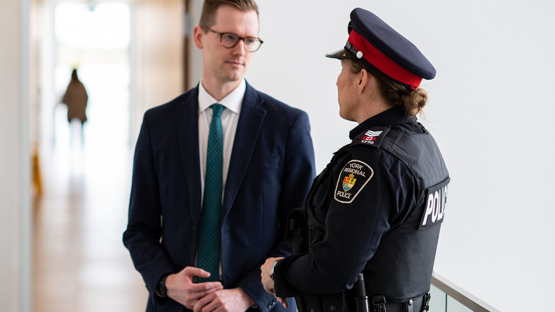 Police officer talking to a businessman
