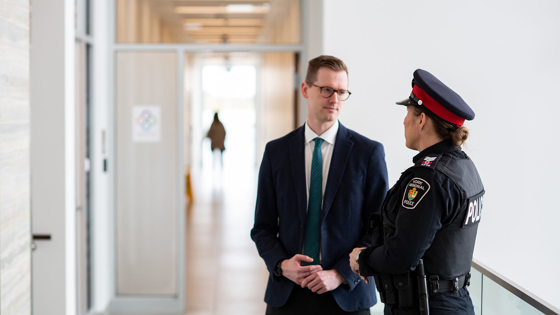 Officer talking to a business professional