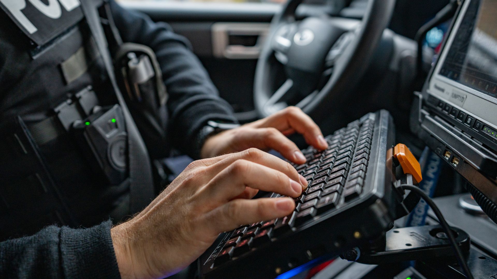 Someone types on a keyboard inside a vehicle