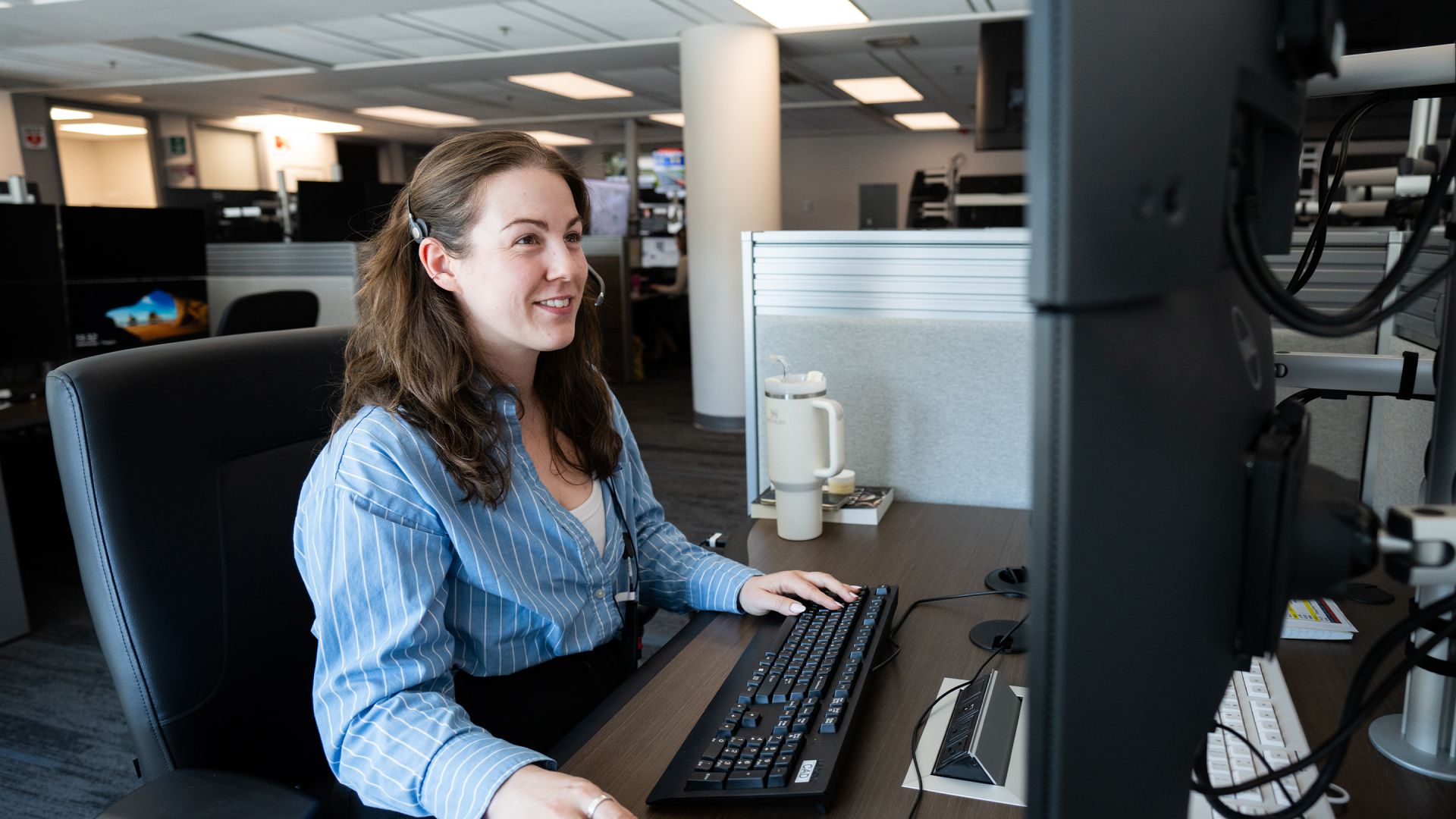 A woman at a computer workstation