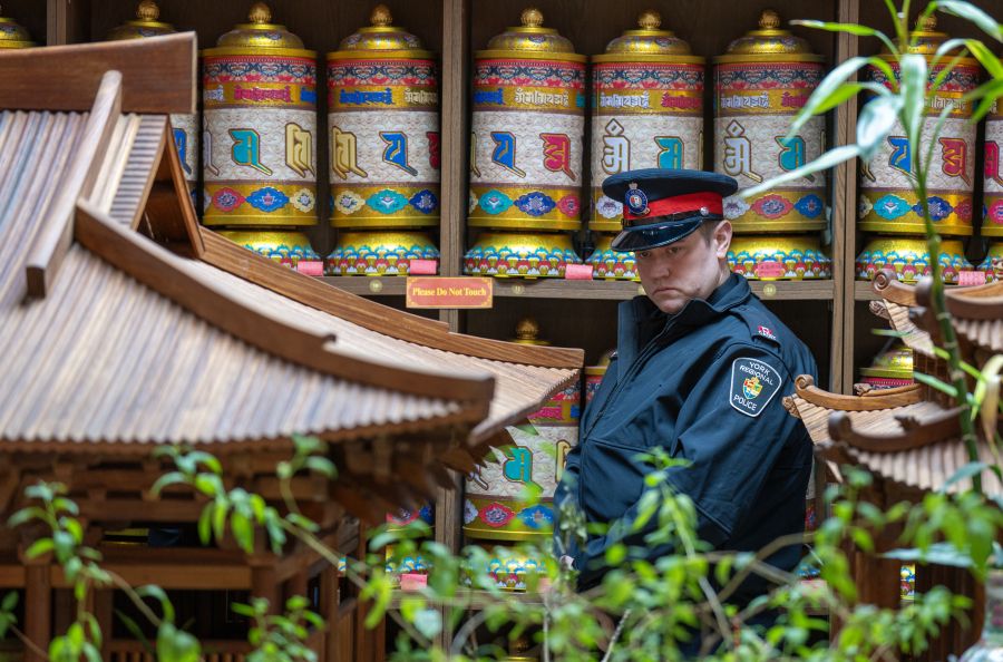 Police officer looking intently in a temple.