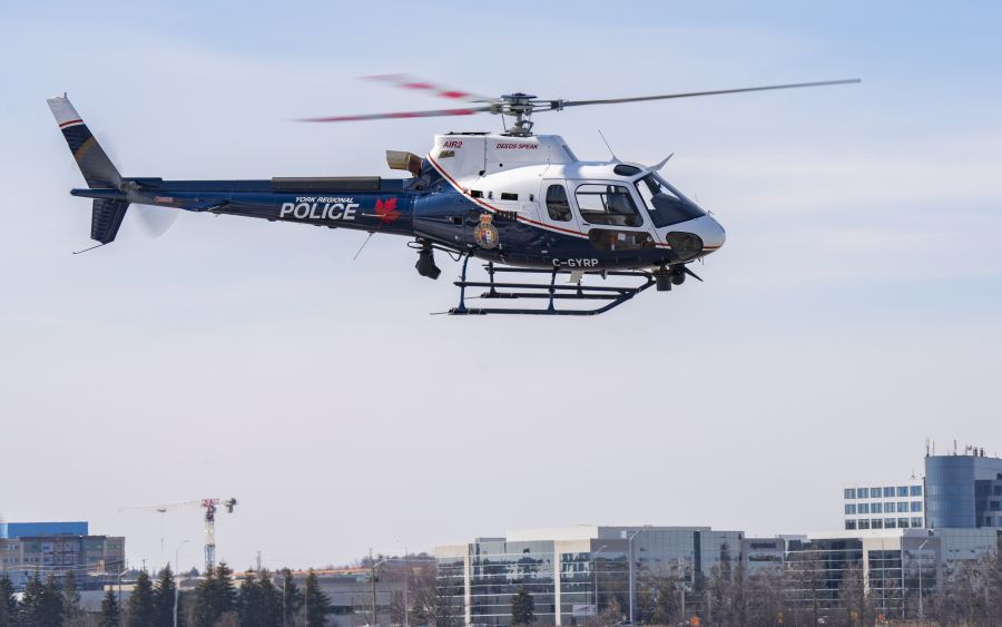 York Regional Police helicopter hover over buildings.