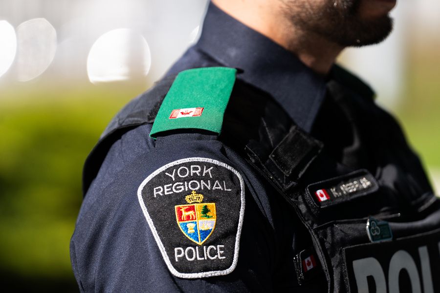 A side profile of an officer wearing a green epaulette in support of mental health.
