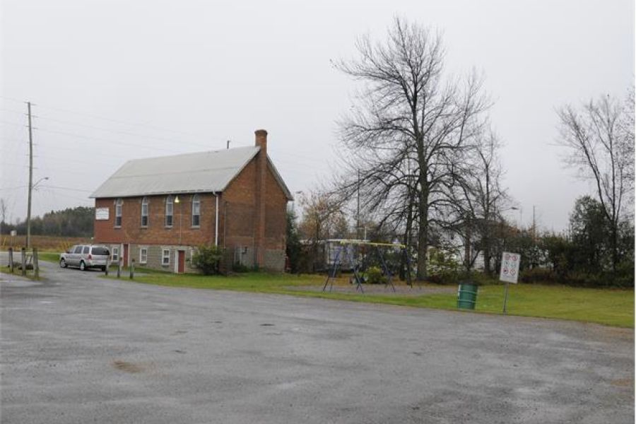 Virginia United Church, a red brick building with a playground