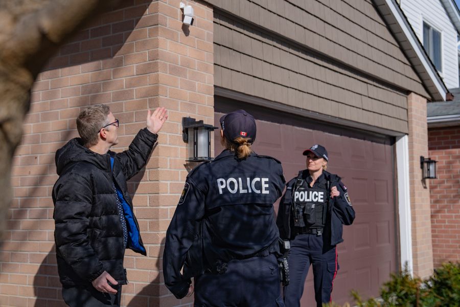 Resident pointing at security cameras