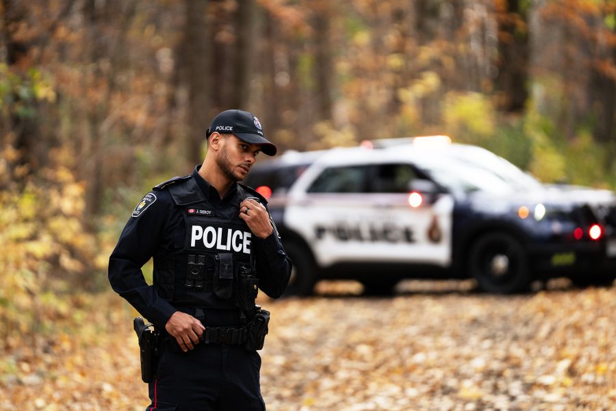 A man in a police uniform on a radio 