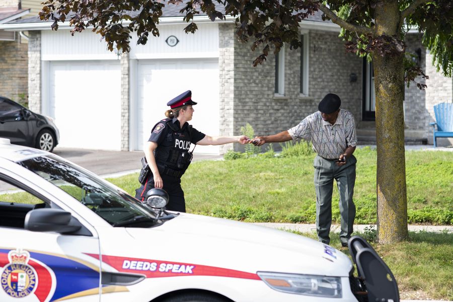 An officer reaches out to a man