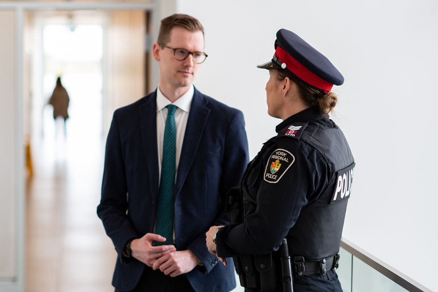 Police officer talking to a businessman