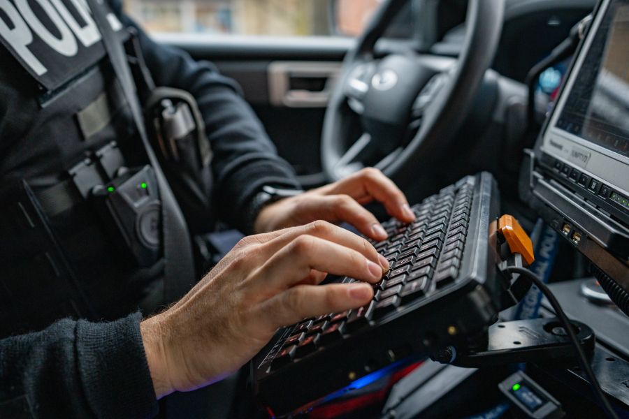 Someone types on a keyboard inside a vehicle