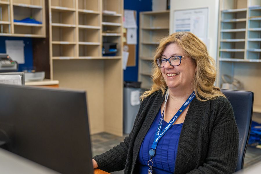 Woman smiling while using a computer
