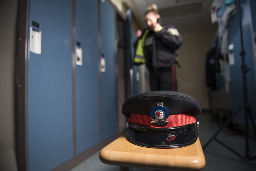 A police hat sits on a bench