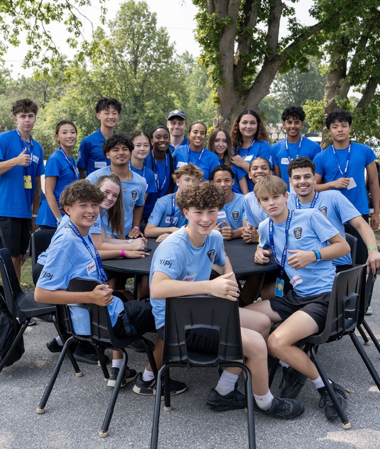 A group of teens in blue shirts