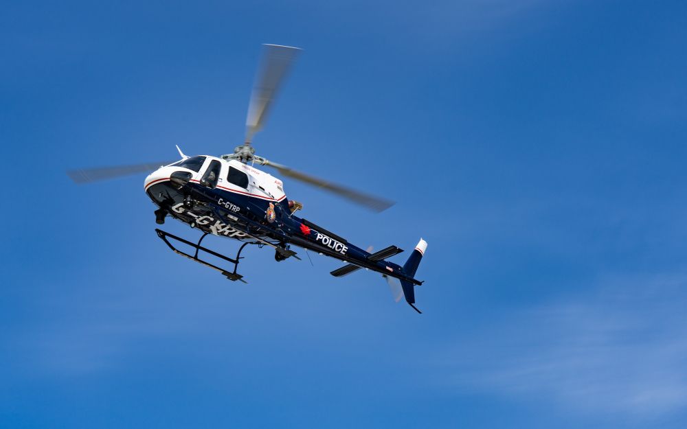 A helicopter in the blue sky