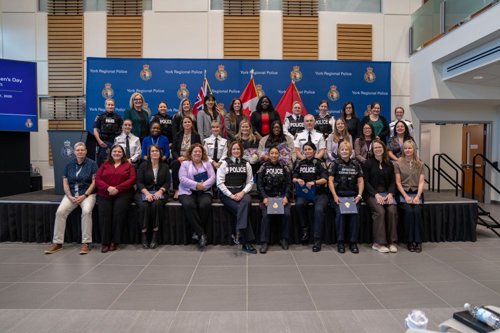 A group of women pose for a photo at the Woman of Distinction Award ceremony